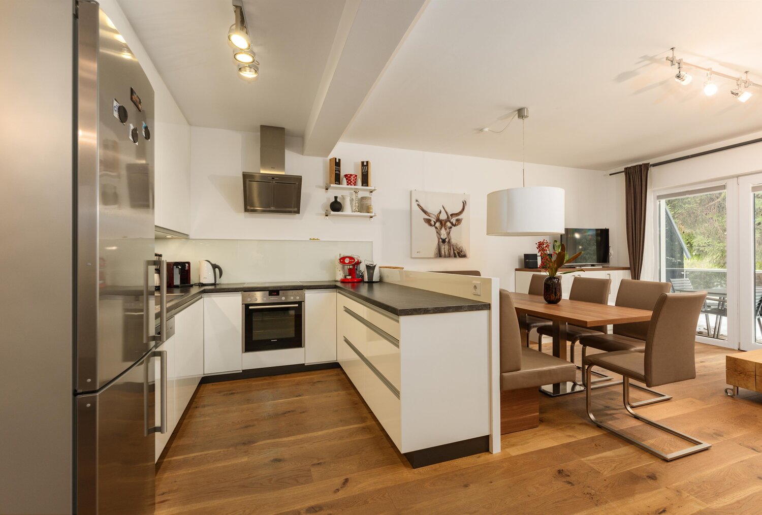 Open-plan kitchen with island and dining area.