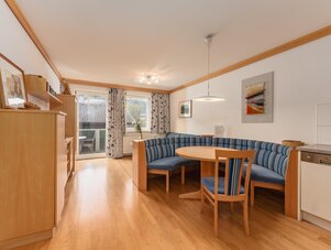 Cozy living room with striped blue seating and round table