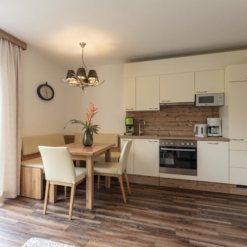 Bright open-plan kitchen and dining area with wooden accents