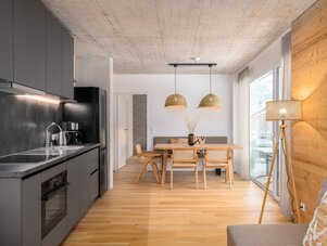 Open-plan kitchen and dining area with wooden accents