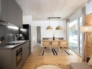 Open-plan kitchen and dining area with natural light