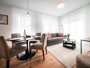 Modern living room with round dining table and sofa